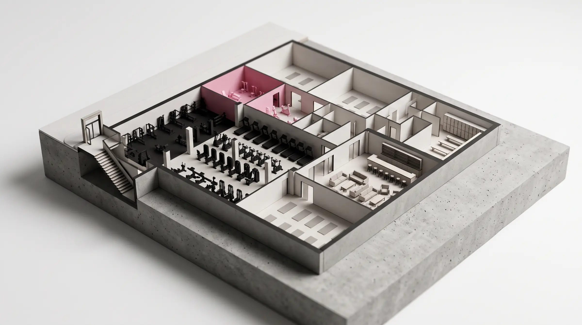 Arkitektonisk skalmodell av en stor anläggning i källarplan med gym, rosa zon, studios, lounge och trappa från gatan.